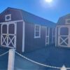 Preowned 12’x28’ Lofted Barn w/ Center Porch, 2 Lofts, 2 Windows, Stained & Metal Roof